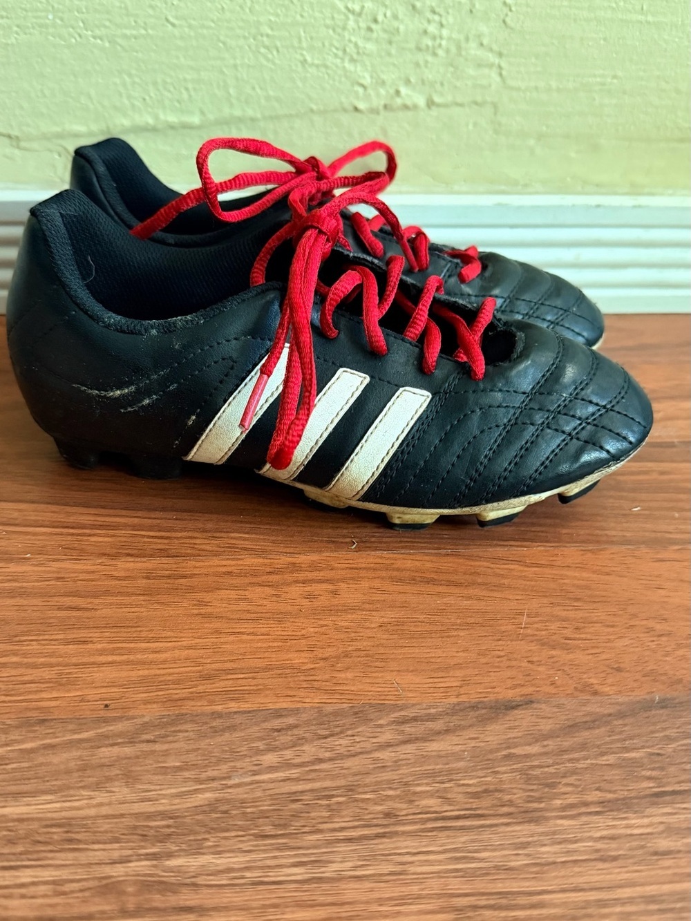adidas Kids Black Soccer Cleats with Red Laces and White Stripes